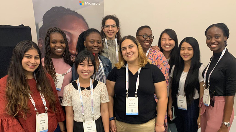 Ten women who won th3 2019 GHC Award pose together at the conference.