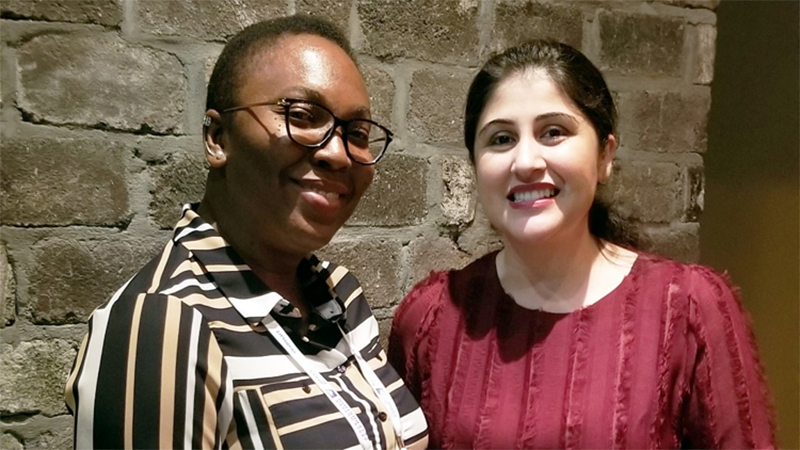 Nonye, on the left, with her new mentor Muazma, on the right, smiling for the camera at GHC 2019.