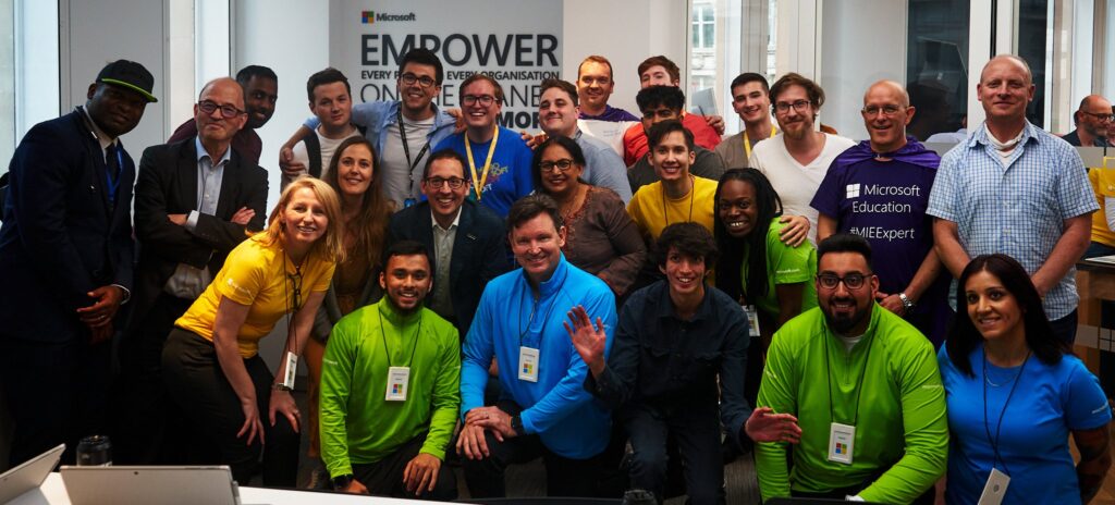 Michael and other Windows Insiders and Windows fans pose with Chris Capossela at the London Microsoft Store opening.